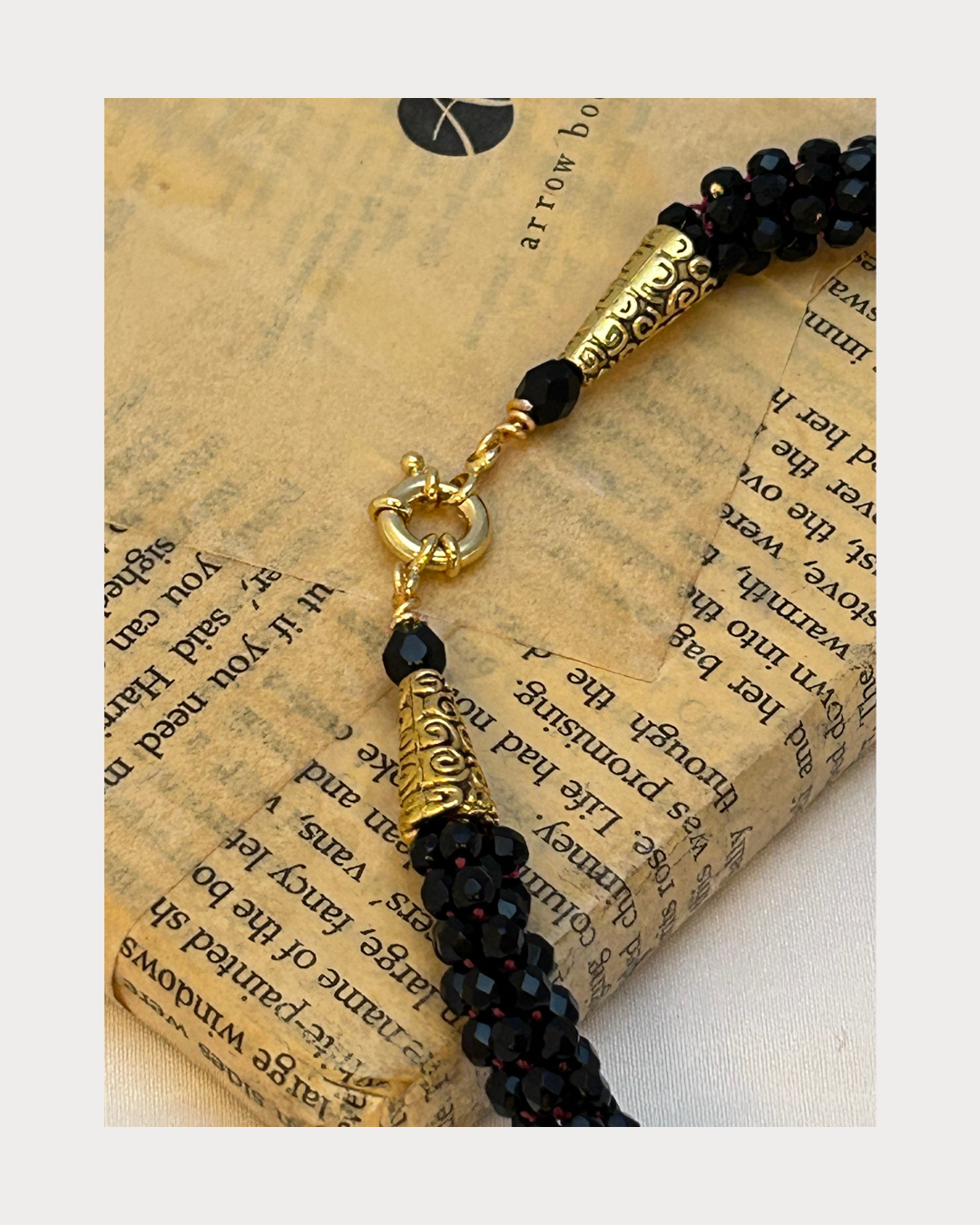 Black and Red Tiger Claw Murano on Kumihimo braid